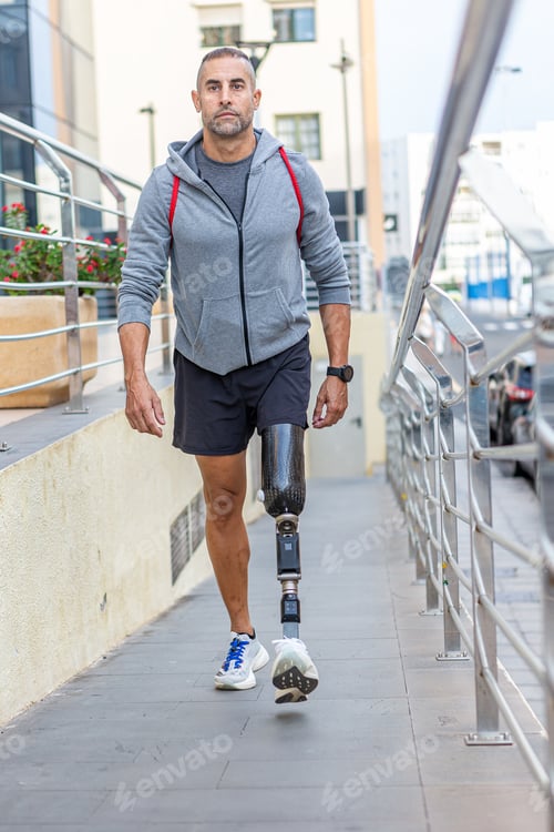 Preview: Handicapped male athlete walking on slope