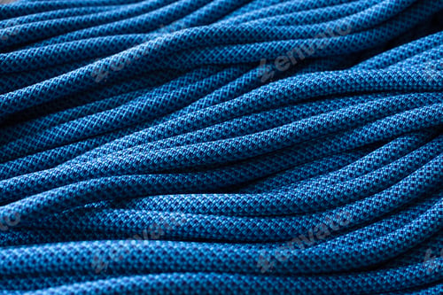 Preview: More than needed. Isolated photo of climbing knots. Top view of blue colored cables