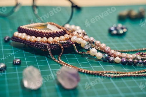Preview: Close up of jewelry necklace in a work place