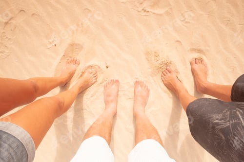 Preview: Above view of family legs together enjoying beach