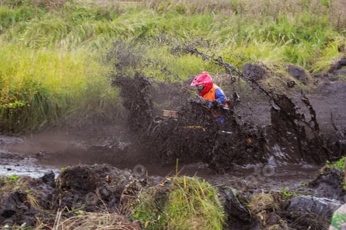 Preview: athlete on a quad bike rides in the mud