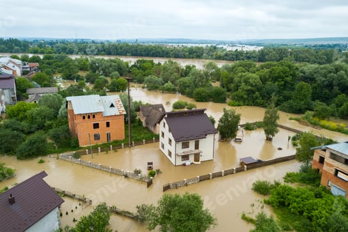 Preview: Aerial view of flooded houses with dirty water of Dnister river in Halych town, western Ukraine.