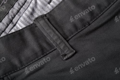 Preview: The Texture Of The Colored Cotton Fabric. Stitched Texture Jeans Background. Fashion Jeans Button