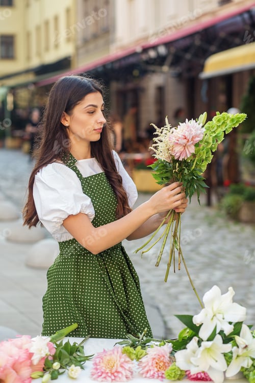 Preview: Florist at work. Woman making beautiful bouquet of different flowers. Workplace. Small business.