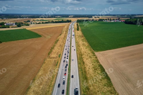Preview: Aerial view of highway traffic with cars and trucks in motion
