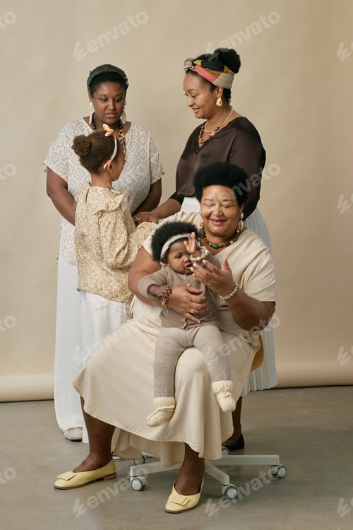 Preview: Multigenerational Family with Small Child during Photoshoot in Studio