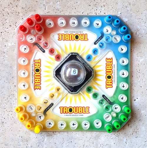 Preview: Top view of classic board game on table with dice