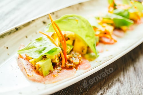 Preview: Raw fresh tuna fish meat salad with avocado and mango