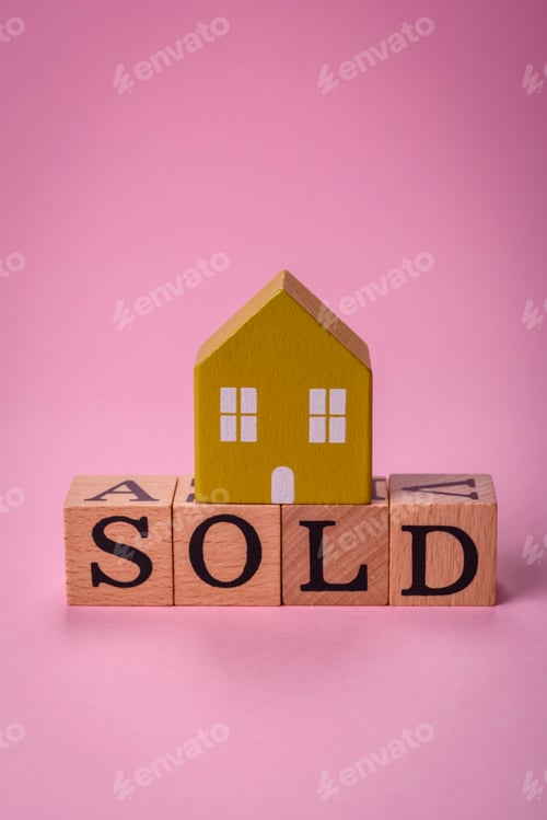 Preview: A small wooden house and the inscription sold. Concept for sale, rental of real estate for a family