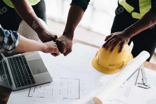 Preview: Team job of teamwork engineer work together in a construction site with business concept.