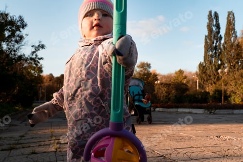 Preview: Toddler baby walking in city park