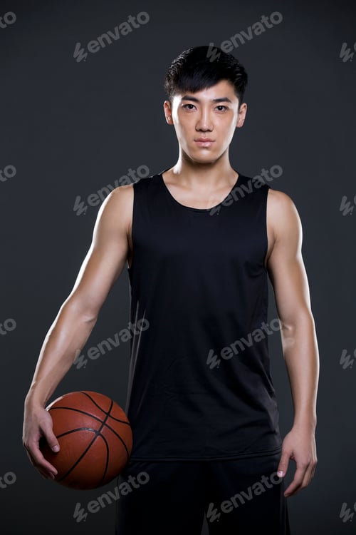 Preview: Young man holding a basketball