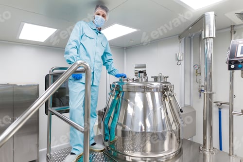 Preview: scientist stand near big metal barrel