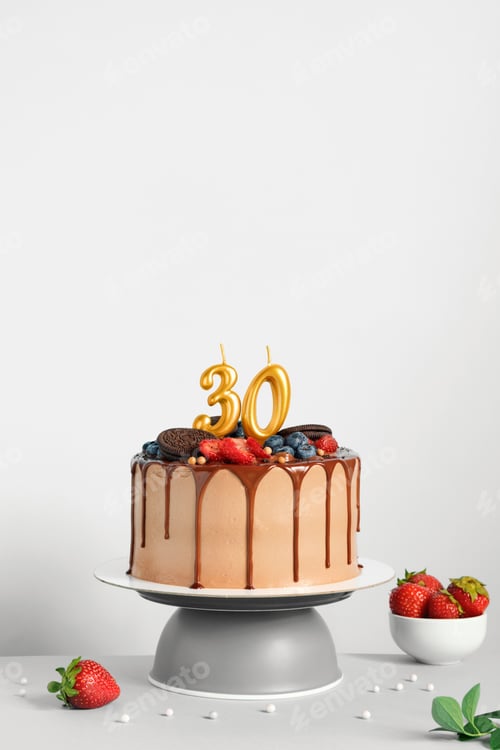 Preview: Chocolate birthday cake with berries, cookies and number thirty golden candles on White background