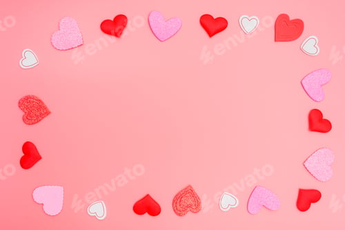 Preview: Pink background framed with red hearts for romantic motives in Valentine's Day, copy space.