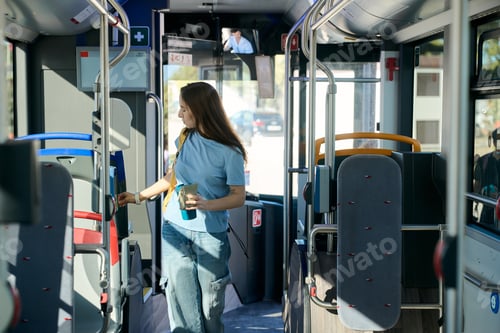 Preview: Woman validating ticket on public transport bus