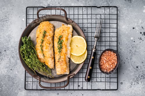 Preview: Baked Cod fish fiilet, fried whitefish meat. Grey background. top view