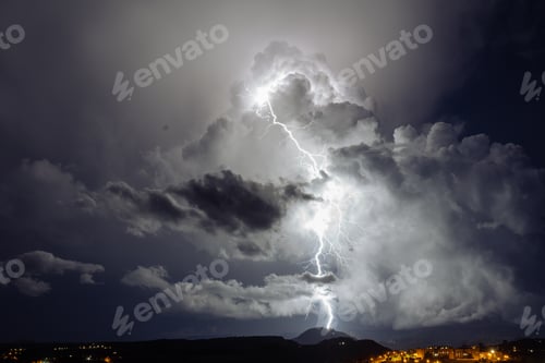 Preview: Lightning in the evening at sunset in the stormy sky