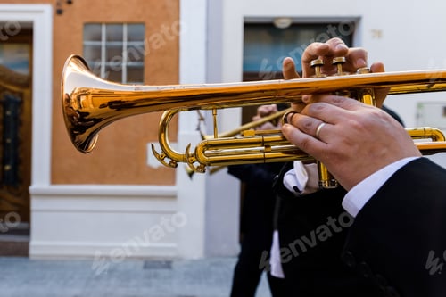 Preview: Trumpeter of a traditional Valencian music band in a parade performing a popular pasodoble.