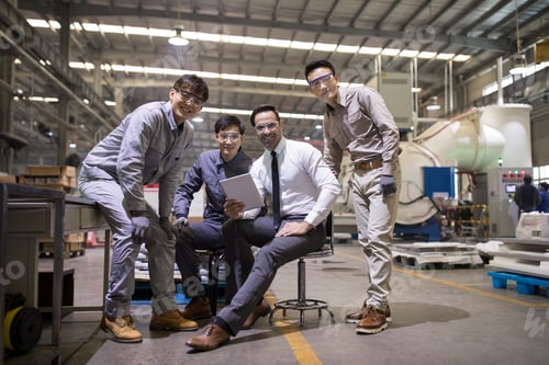 Preview: Businessman and engineers talking in the factory