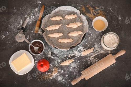 Preview: Flat lay composition with ingredients and raw croissants on grey background