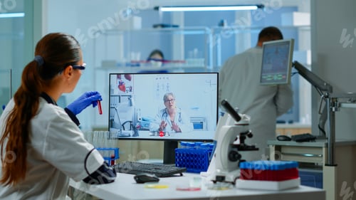 Preview: Scientist listening professional doctor on video call