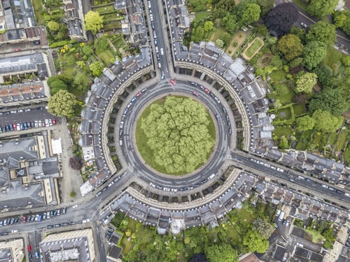 Preview: Aerial view of a beautiful cityscape with roads, buildings, cars, and trees in Bath, UK