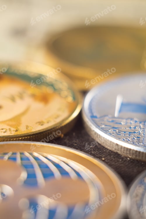 Preview: Vertical closeup shot of many shiny cryptocurrency coins