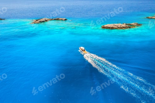 Preview: Aerial view of the speed boat in clear blue water at sunny day