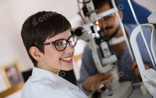 Preview: Optometrist examining patient in modern ophthalmology clinic