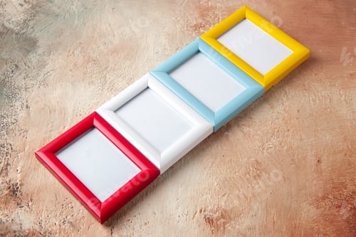 Preview: Side view of four photo frames hung on side by side on mix color wall with free space