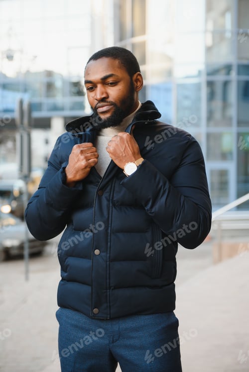 Preview: African American man in stylish new clothes on the street