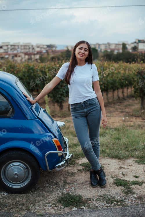 Preview: Portrait of woman leaning against car in countryside, Florence, Toscana, Italy