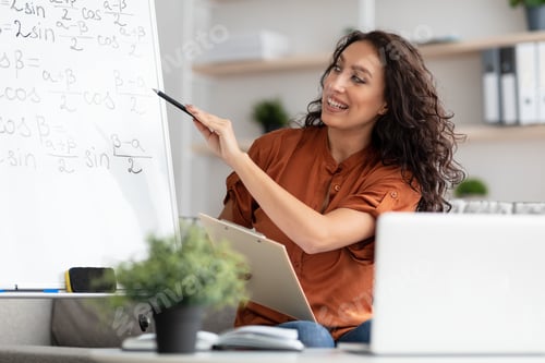 Preview: Female teacher explaining math to students using pc