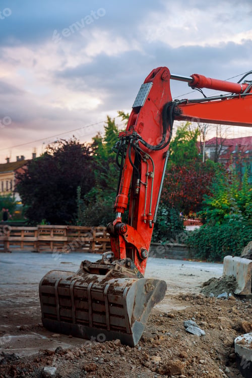 Preview: Excavator bucket digging ground for installing pipes at the street
