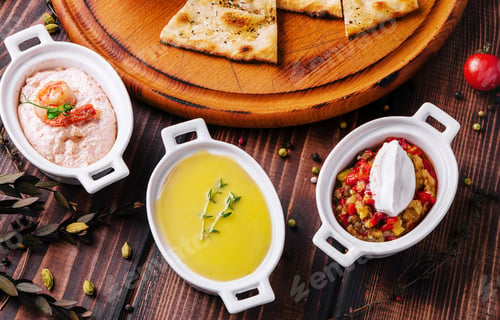 Preview: Italian focaccia bread with antipasti, top view