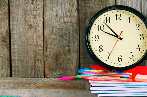 Preview: Watches and school tools. On wooden background.