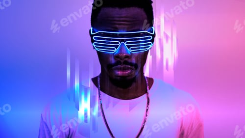 Man in Light Up Glasses Against Abstract Background