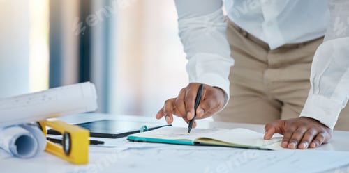 Preview: Architect hands drawing architecture sketch design with blueprint, floor plan engineering paper and