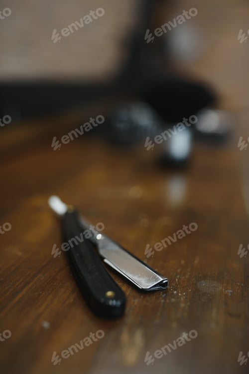 Preview: Vintage barber shop tools on old wooden background with copy space.