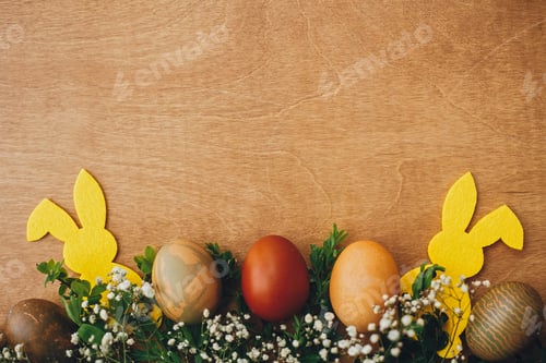 Preview: Stylish easter eggs and yellow bunny on rustic wooden table