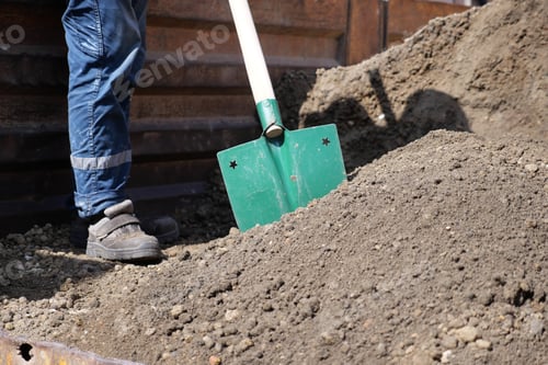 Preview: a man digs his spring garden with an old shovel.