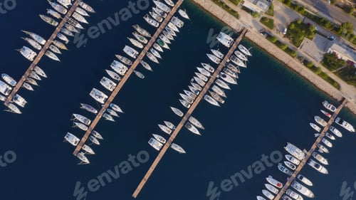 Preview: Aerial top view of boats and yachts in modern marina.