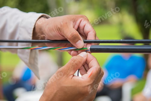Preview: Technicians are installing optic fiber.