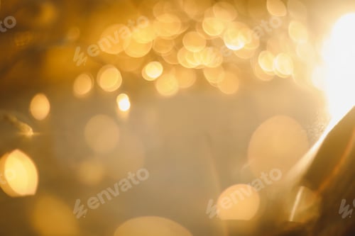 Preview: abstract shiny gold background. blured bokeh glowing golden background for design with copyspace