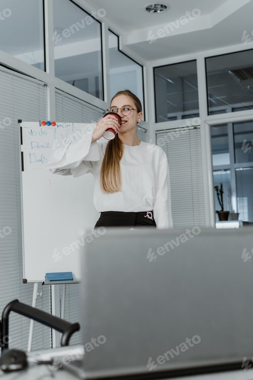 Preview: Remote Meetings, Video Conferencing. Young business woman drinking coffee and communicating with