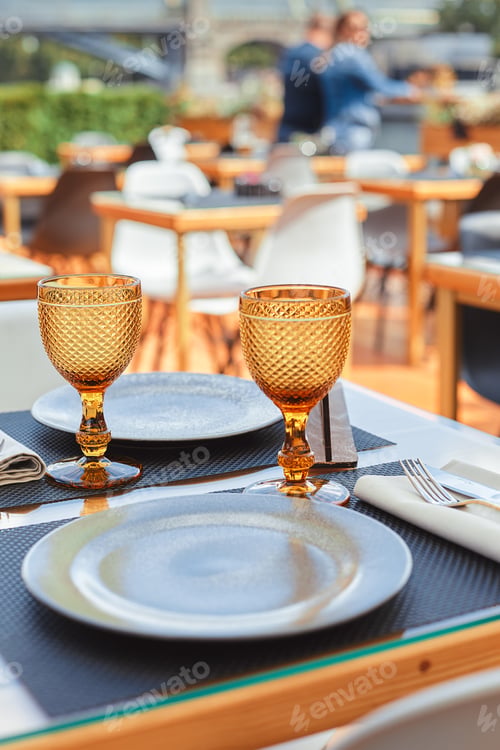 Preview: A romantic dinner in the summer on the deck of the ship at the bottom m with two glasses of white