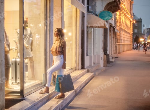 Preview: One Young Woman, Windows Shopping In Front Of Store On Street Outdoors.