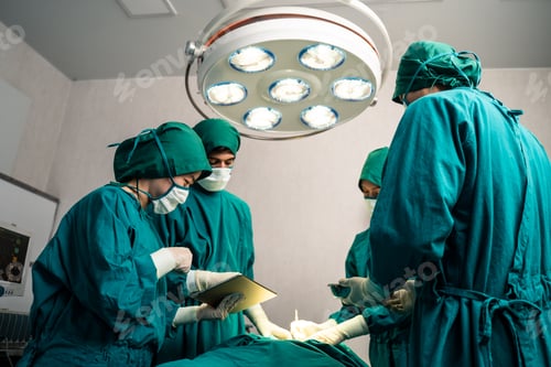 Preview: Medical Team Performing Surgery in Bright Operating Room