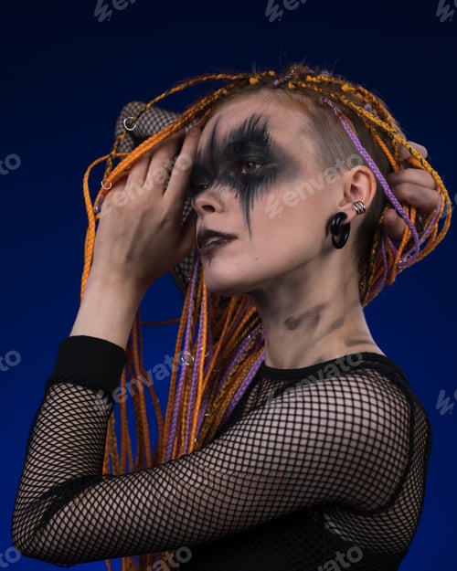 Preview: Female with horror black stage makeup painted on face and without dangerous dreadlocks hairstyle